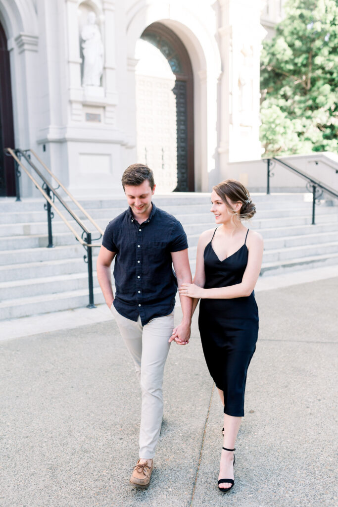 couple holding hands and walking in Midtown Sacramento California for their engagement session with Sarah Schweyer Photography